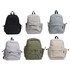 A collection of six Mono Backpacks in black, grey, light grey, olive green, and cream, featuring various pockets and a logo.