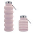 A drink bottle in soft pink, featuring a collapsible design and a metal lid with a carabiner.
