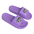 Purple PVC slides featuring a branded strap. The design is simple and modern.