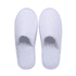 White hotel slippers with an open-toe design, featuring a soft, plush texture and a simple style.