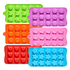 A collection of silicone ice trays in various colours, featuring custom moulds in shapes like flowers, hearts, and stars.