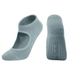 A pair of light blue open-top yoga socks featuring grip dots on the soles and a logo on one sock.