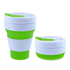 A collapsible silicone cup in green and white, featuring a lid and a logo. Two sizes are displayed, stacked together.