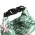 A waterproof dry bag featuring a tropical leaf design and a black buckle closure. It has a vibrant green and white colour scheme.