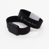 A black and white Arc Bracelet LED USB flash drive with a smooth, flexible silicone design.