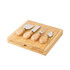 A bamboo cheese board set with four stainless steel cheese knives featuring wooden handles.