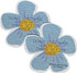 A pair of blue daisy-shaped seed papers with instructions and a logo on the surface.