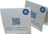 A white seed paper table tent card with a QR code and branding, featuring a textured surface with speckles.