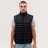 A black puffer vest with a high collar, featuring a quilted design, displayed on a model.