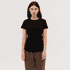 A black women's essential tee with a classic fit, paired with brown pants. The design features a logo on the shirt.