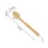 A long-handled shower brush with a natural wood handle and a detachable head, featuring white bristles.