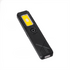 A rechargeable work light in black with a bright yellow LED panel and a circular switch.
