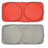 A red and silver solar car sun shade featuring two circular sections, with a black trim.