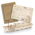 A wooden model of a cargo ship, unassembled parts and packaging displayed, featuring natural wood colour.