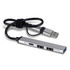 A silver USB hub with multiple ports and a connected cable, designed for technology use.