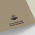 A sugarcane paper soft cover notebook with a brown cover and a logo, featuring eco-friendly pages made from sugarcane waste.