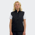 A woman wearing a black, sleeveless vest with a zip front and a logo on the left side.