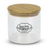 A large round glass storage canister with a bamboo lid and a decorative logo on the front.