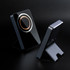 A black wireless charging power bank with a sleek design and a stand, featuring a circular charging area.