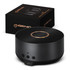 A wireless charging speaker in black with a sleek design, accompanied by its packaging featuring a logo.