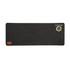 A dark grey desk mat with a textured surface and a circular logo in the corner.
