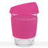 A reusable coffee cup with a pink silicone lid and a clear glass body, featuring a built-in logo.
