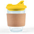 A reusable coffee cup featuring a transparent design, a yellow snap lid, and a cork band for grip.