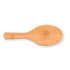 A bamboo hair brush with an engraved logo on the handle.