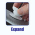 A phone grip is being expanded by a hand, with a textured background showcasing its design.