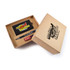 A gift set featuring a notebook, a pen, and a USB drive, all presented in a cardboard box with colorful branding.