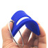 A blue silicone luggage tag held in a hand, featuring a loop for attachment and a smooth surface.