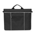 A black Envoy Satchel with a zippered main compartment and a front pocket, featuring white piping accents.