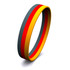A silicone wristband featuring grey, red, and yellow stripes, showcasing a smooth, flexible design.