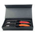 A gift set featuring two black pens with red and orange accents in a sleek grey box.