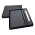 A black notebook and pen gift set presented in a black box with a sleek design. The notebook features a smooth cover.