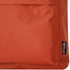 An orange backpack featuring a textured fabric and a tag indicating recycled materials.