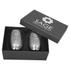 A glass coffee and tea set in a black gift box featuring a logo, with two clear glass cups inside.