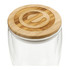 A drink bottle with a clear glass body and a round bamboo lid, featuring a subtle branding element on top.