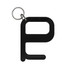 A black hygiene key with a keyring attachment. The design features a simple shape.