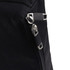 A close-up of a black fabric with a silver zipper and metal accents, featuring a sleek, modern design.