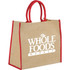 A large jute tote bag in natural brown with red handles and a logo. Ideal for carrying various items.