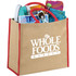 A large jute tote bag in natural with red handles, filled with books, a drink bottle, and other items.