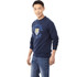 A navy blue fleece crew jumper for men featuring a logo on the front, paired with denim jeans.
