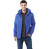 A men's fleece lined jacket in blue, featuring a hood and a zippered pocket. The model wears it over a grey polo shirt.
