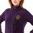 A women's polyfleece jacket in purple featuring a logo and black flame design on the front.