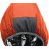 A packable women's jacket in orange and grey, featuring a hooded design. It has a logo on the fabric.