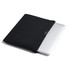 A black laptop sleeve partially covering a silver laptop, featuring a small logo on the front.