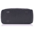 A black duffle bag featuring a flat base and protective feet, showcasing a sturdy design and ample space.