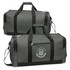 A green duffle bag featuring a logo, with black straps and zippers, designed for various uses.