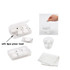 A clear case containing six white press towels, alongside a hand demonstrating their use in water.